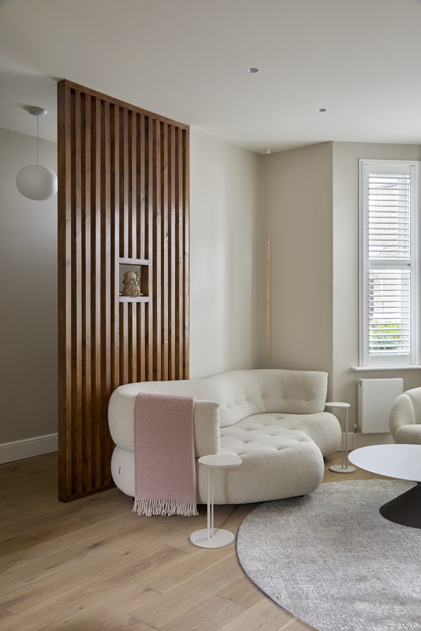Timber slatted screen dividing the living space at Achilles Road