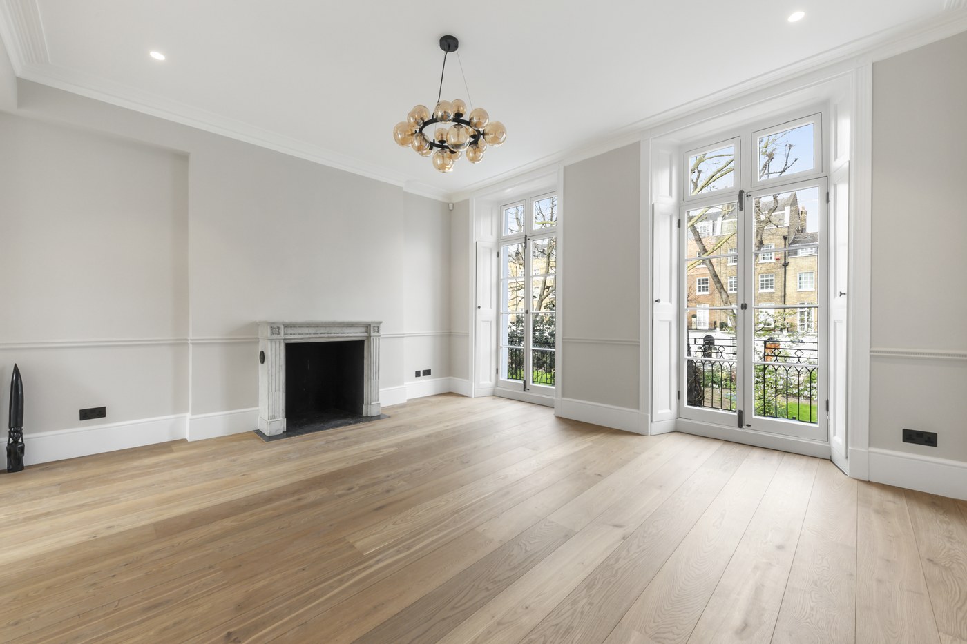 Reception room at Brompton Square with reinstated chimneypiece, cornice and oak flooring
