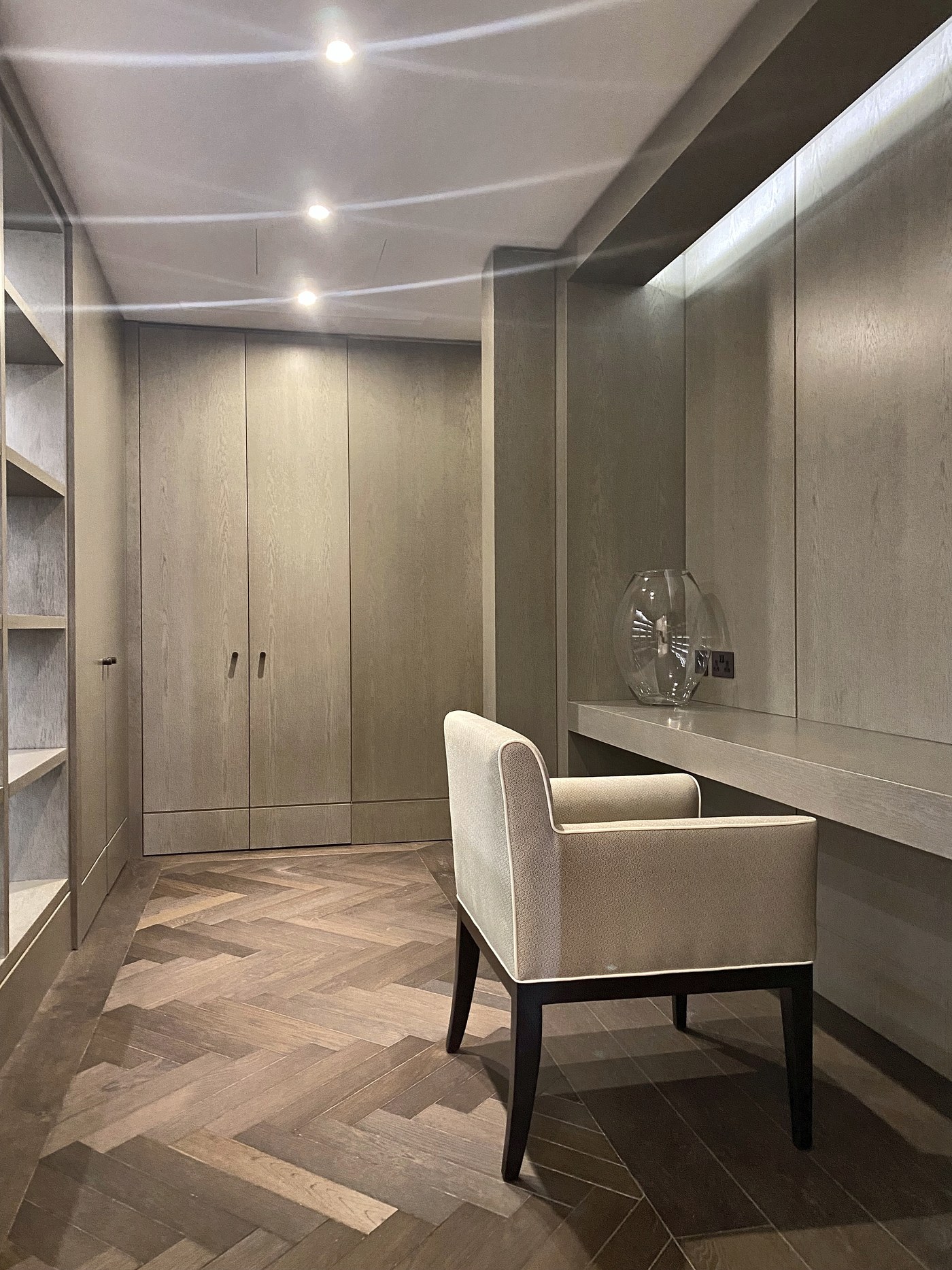 Fitted dressing joinery at Connaught Place above a herringbone timber floor