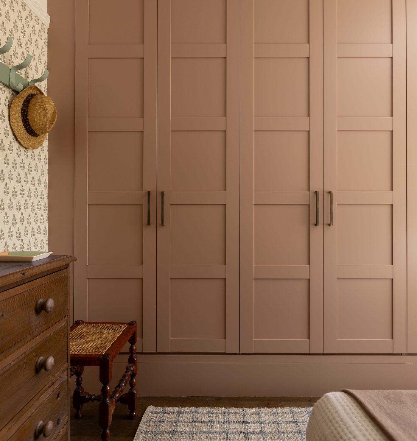 Painted fitted wardrobes in a bedroom at Garratt Lane