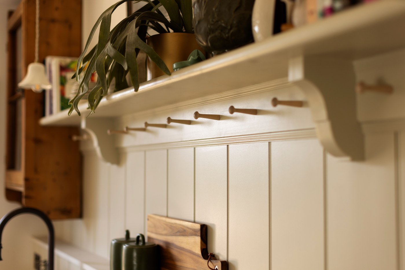 Joinery detail at Garratt Lane: peg rail above tongue-and-groove panelling