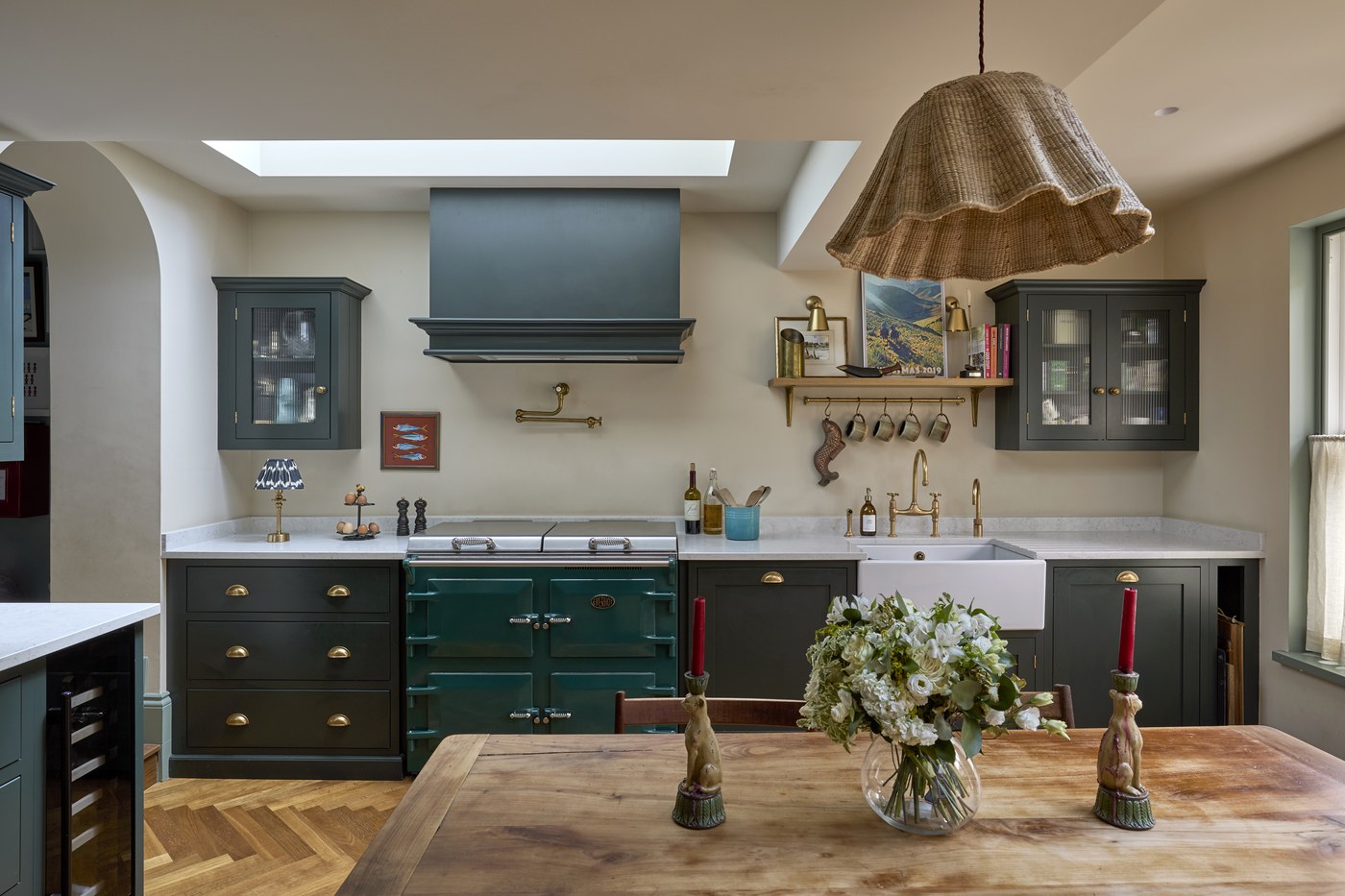 Kitchen at Melrose Gardens with painted joinery, a glazed dresser and a timber-topped island