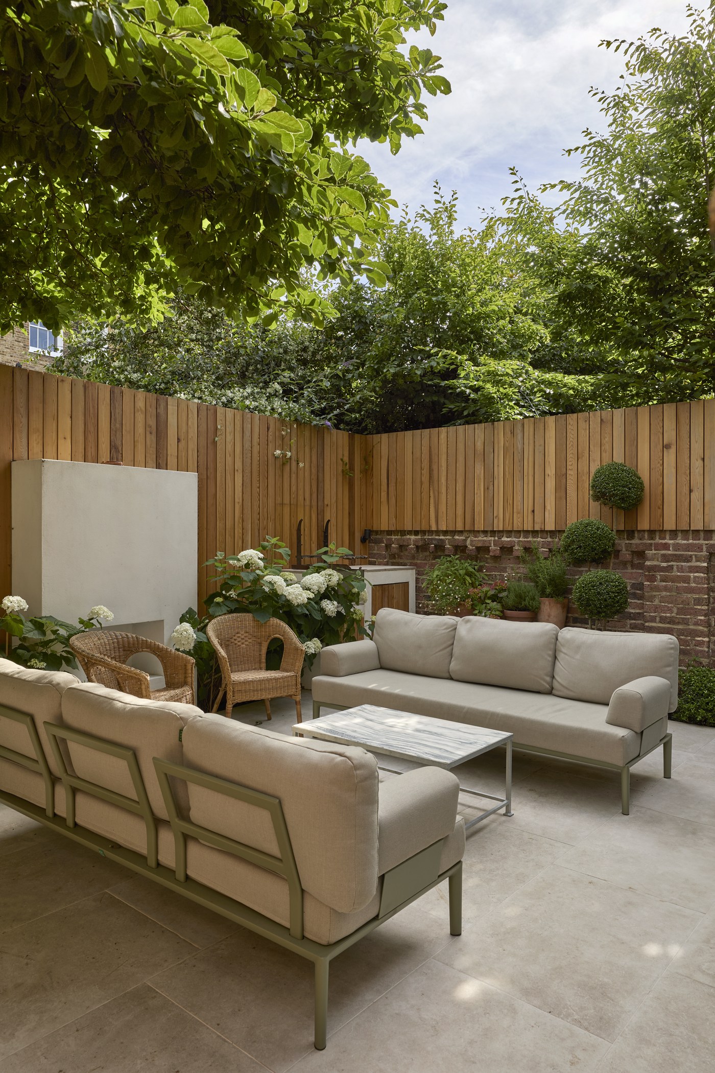 Rear garden at Melrose Gardens after landscaping, with new fencing and planting