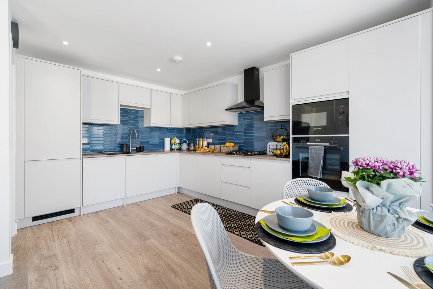 Open-plan kitchen and dining area in an apartment at Millway