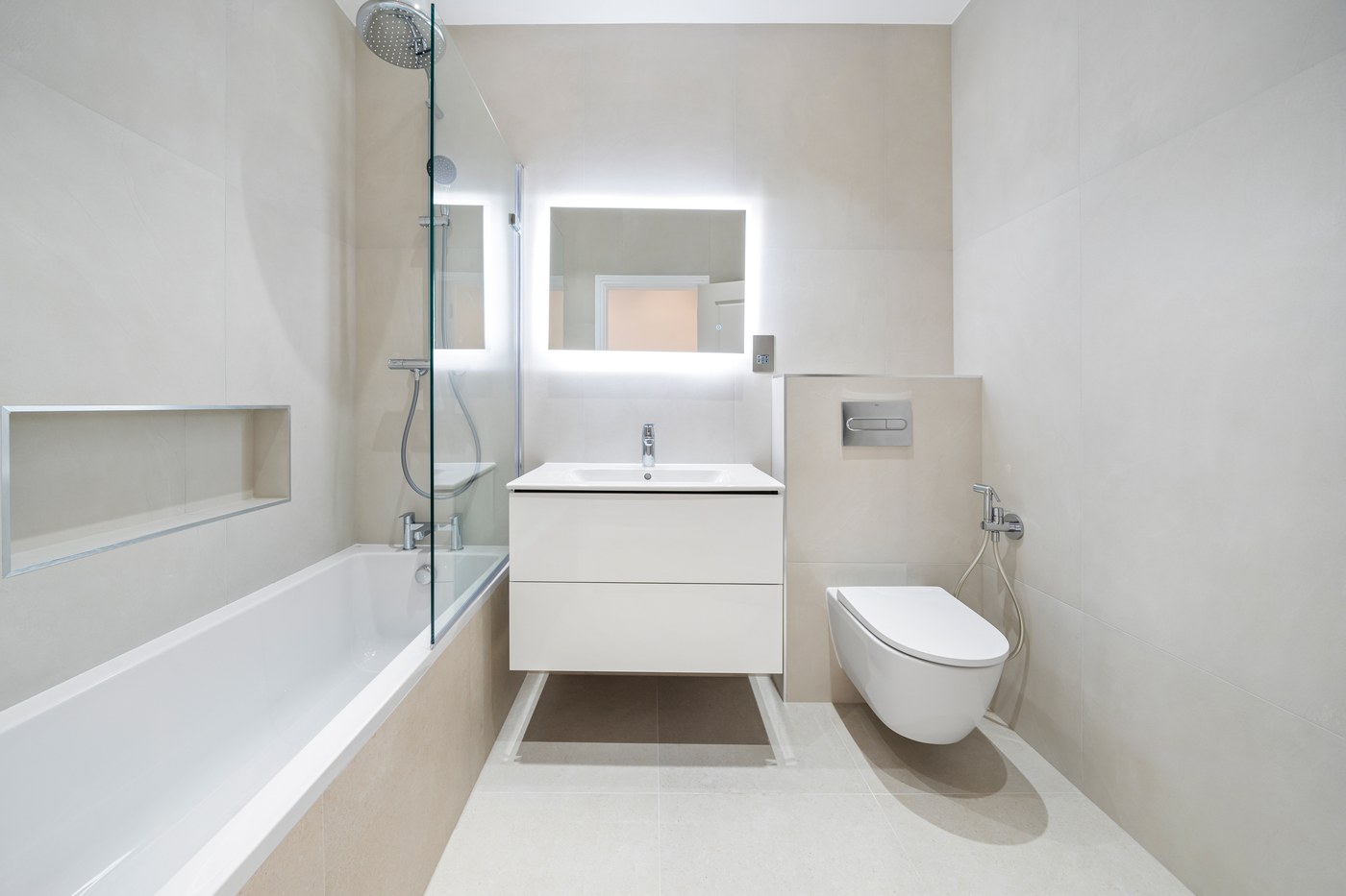New bathroom at St John's Wood Road with a fitted vanity, bath and wall-hung WC